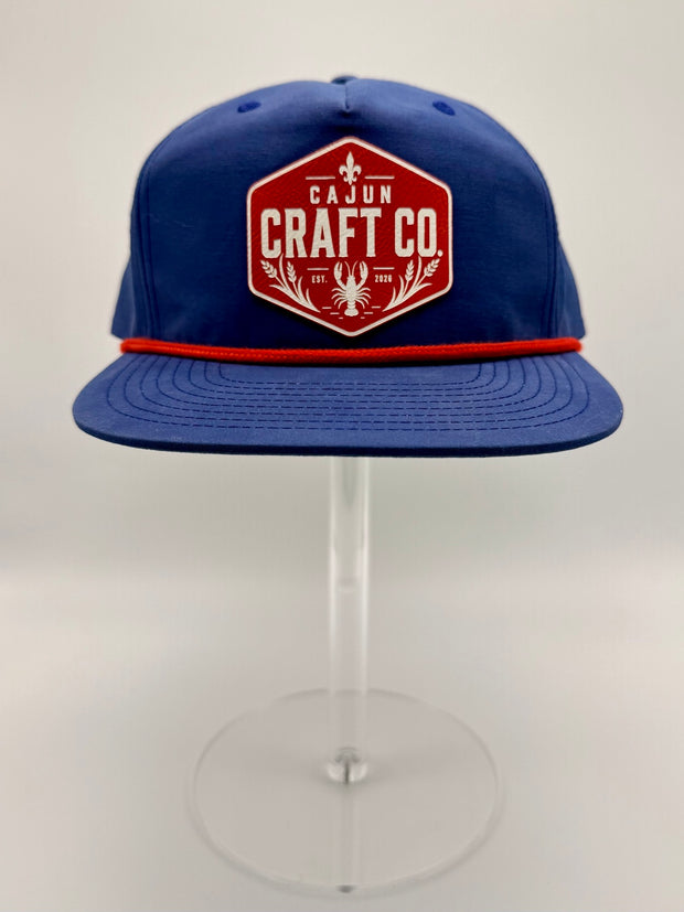 Blue rope hat with red and white Cajun Craft Co patch