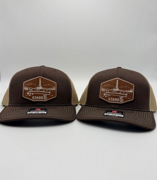 Two brown Richardson hats with Stage 3 Separation patches
