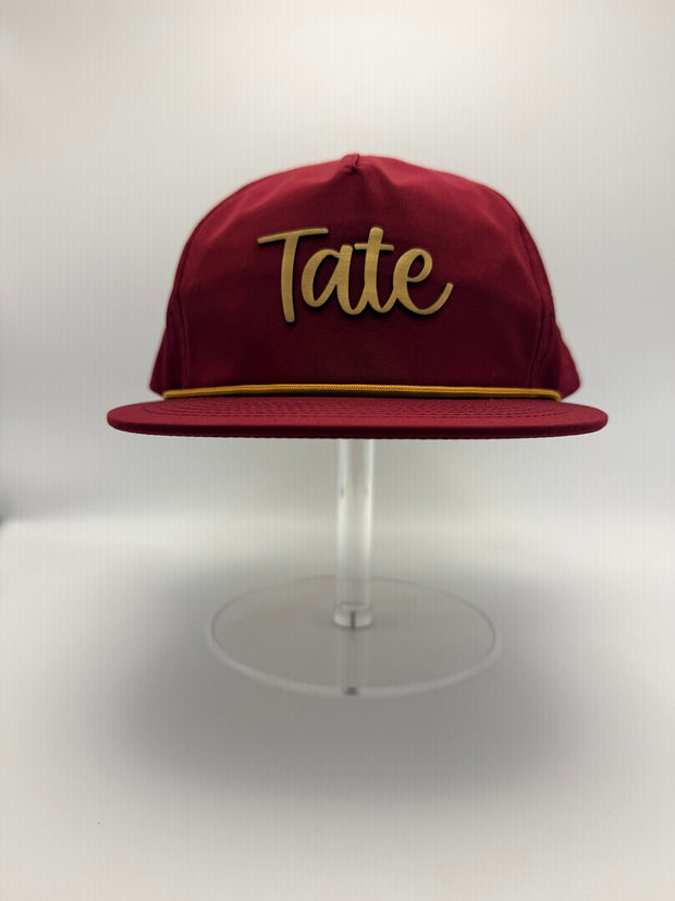 Maroon custom hat with gold Tate lettering